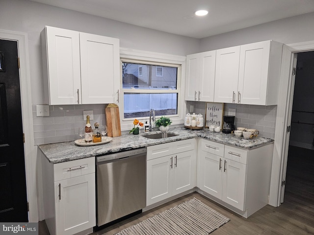 kitchen with dishwasher and white cabinets