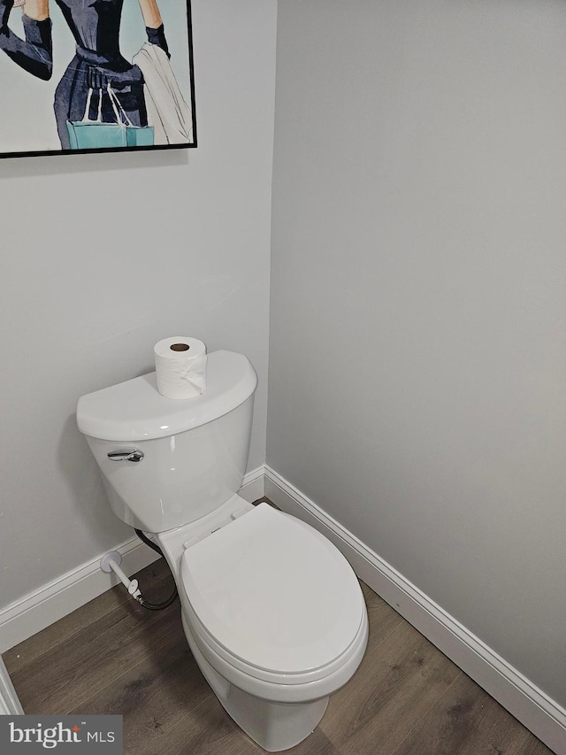 bathroom featuring toilet and hardwood / wood-style flooring