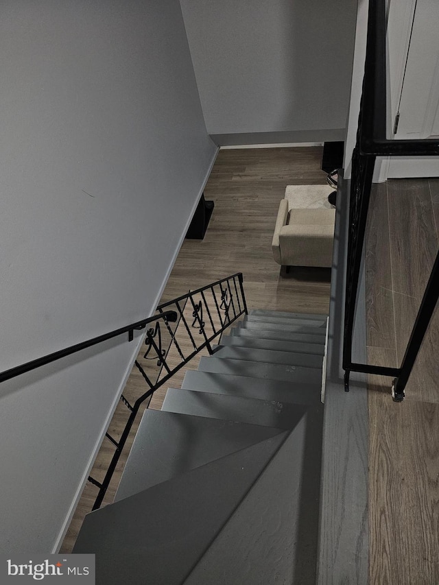 stairs with wood-type flooring