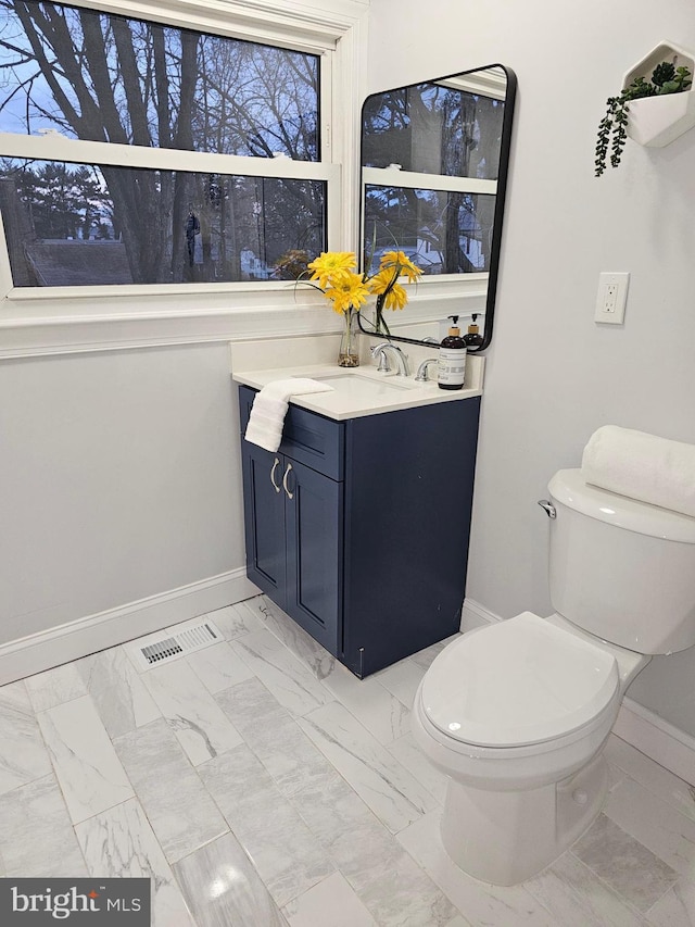 bathroom with vanity and toilet