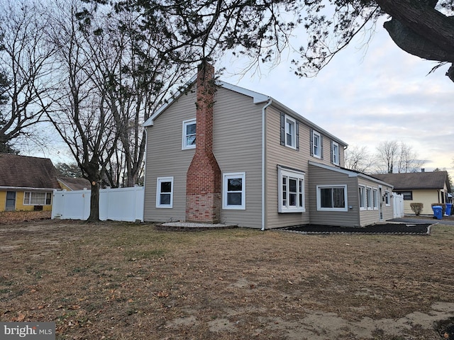 54 Shelbourne Ln, Willingboro, NJ 08046 - view of side of home with a chimney