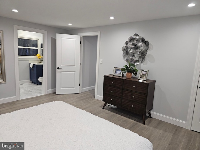 bedroom with light hardwood / wood-style flooring