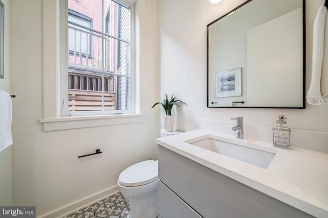 bathroom with vanity and toilet