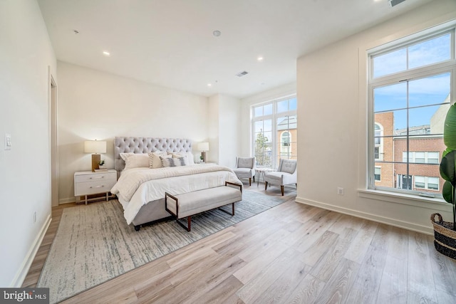 bedroom with light hardwood / wood-style flooring