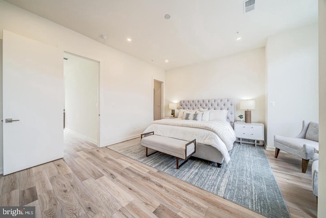 bedroom with light hardwood / wood-style flooring