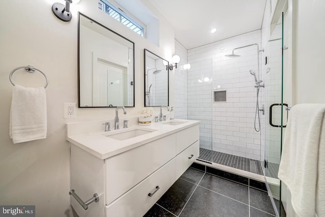 bathroom featuring vanity, tile patterned flooring, and an enclosed shower