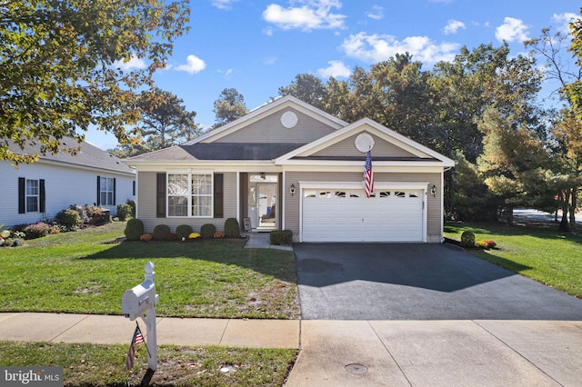 ranch-style home with a garage and a front lawn