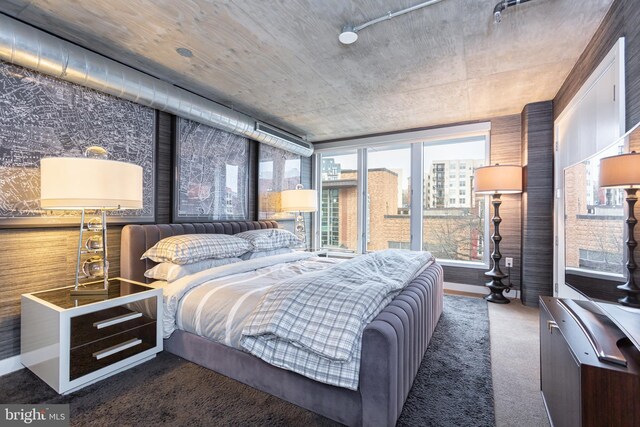 bedroom featuring dark colored carpet