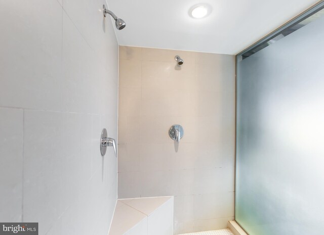 bathroom with a tile shower