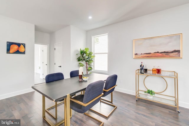 dining space with baseboards, recessed lighting, and dark wood-type flooring
