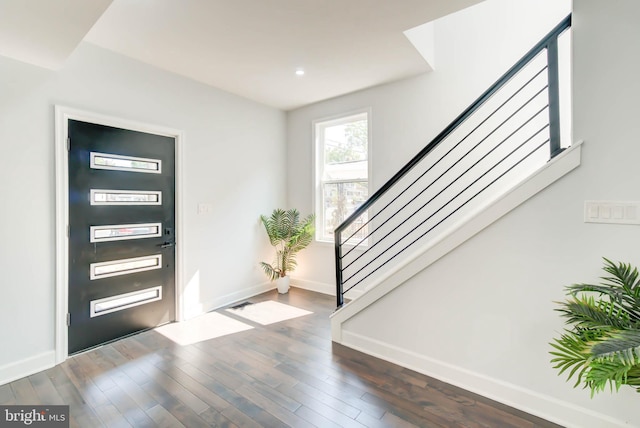 foyer entrance with dark wood-style floors, stairs, recessed lighting, and baseboards