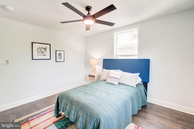 bedroom with dark wood-type flooring and ceiling fan