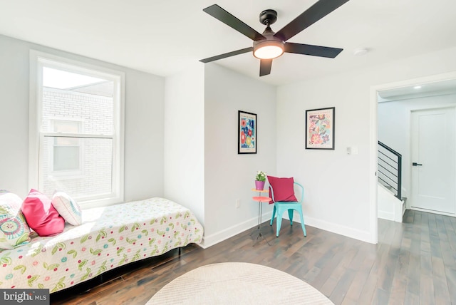 bedroom featuring ceiling fan and dark hardwood / wood-style flooring