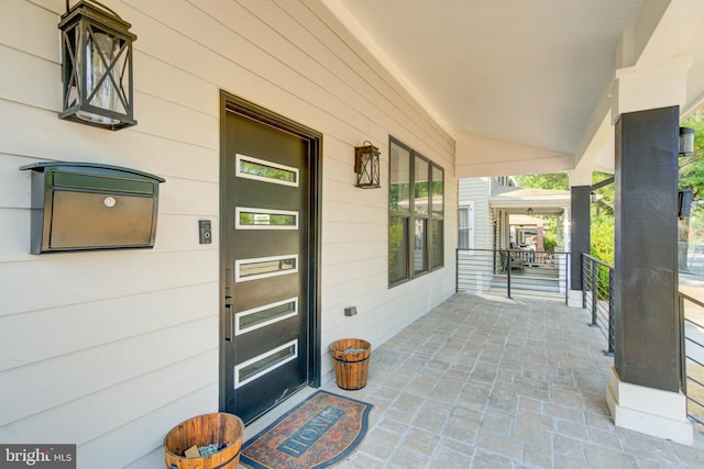 doorway to property with covered porch