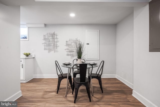 dining area featuring hardwood / wood-style flooring and electric panel