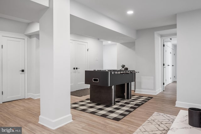 rec room with recessed lighting, light wood finished floors, and baseboards