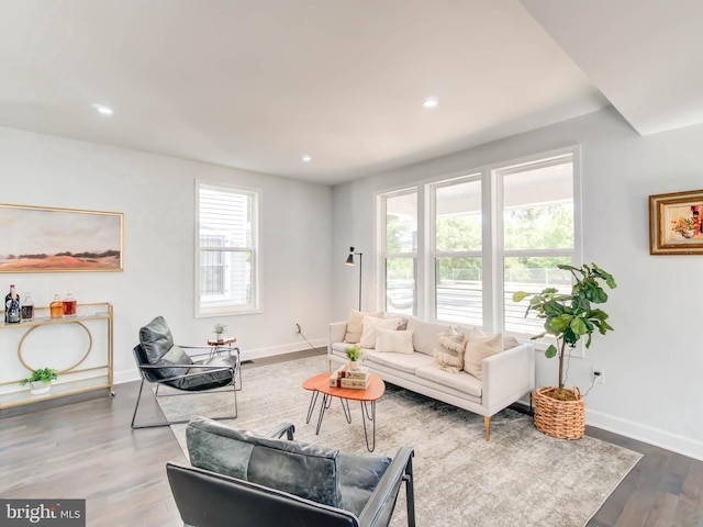 living area featuring dark wood-style flooring, recessed lighting, and baseboards