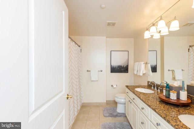 bathroom with toilet, vanity, a shower with shower curtain, and tile patterned flooring