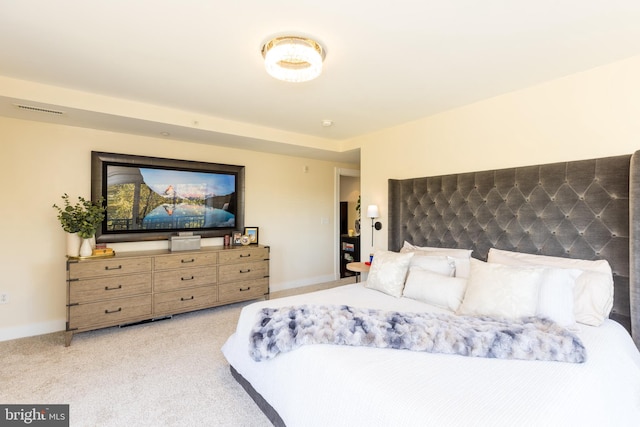 bedroom featuring light carpet