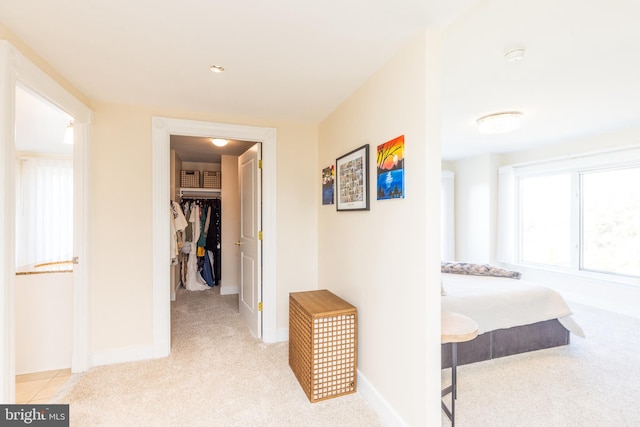 corridor with light colored carpet