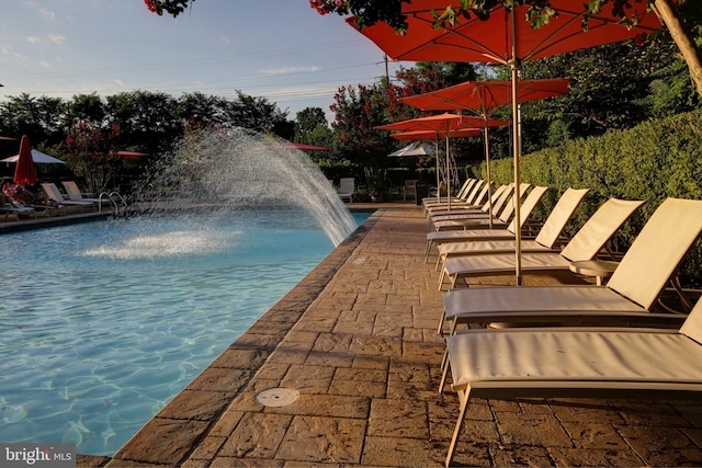 view of pool featuring pool water feature