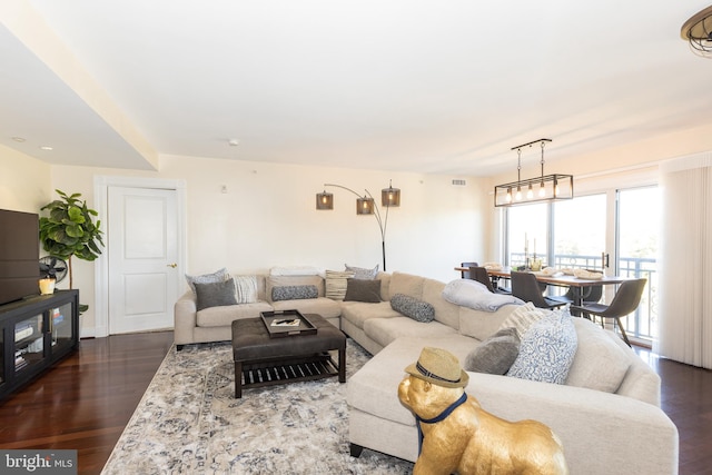 living room with dark hardwood / wood-style flooring