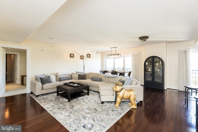 living room with wood-type flooring and plenty of natural light