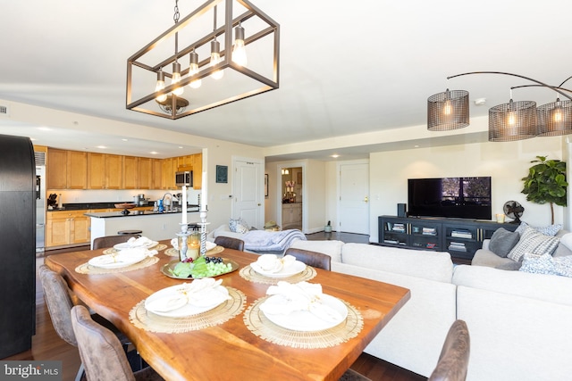 dining room with sink and hardwood / wood-style floors