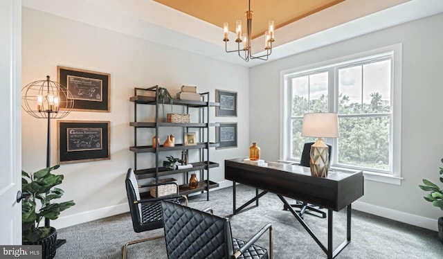 office space featuring a notable chandelier, carpet floors, and a healthy amount of sunlight