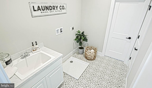 laundry area with hookup for a washing machine, light tile patterned flooring, sink, and electric dryer hookup