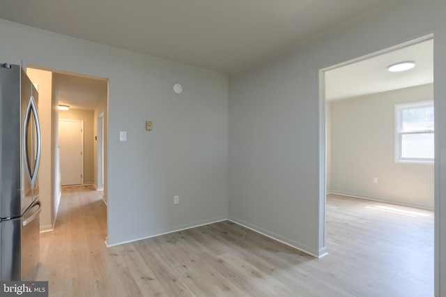 spare room featuring light wood-type flooring