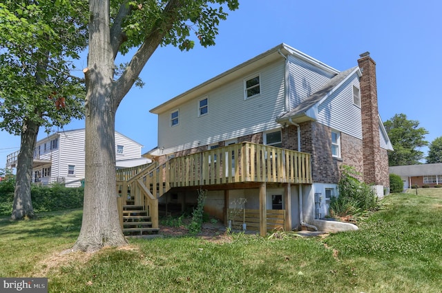 back of house with a yard and a deck