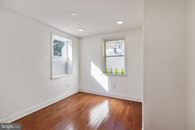 empty room with wood-type flooring