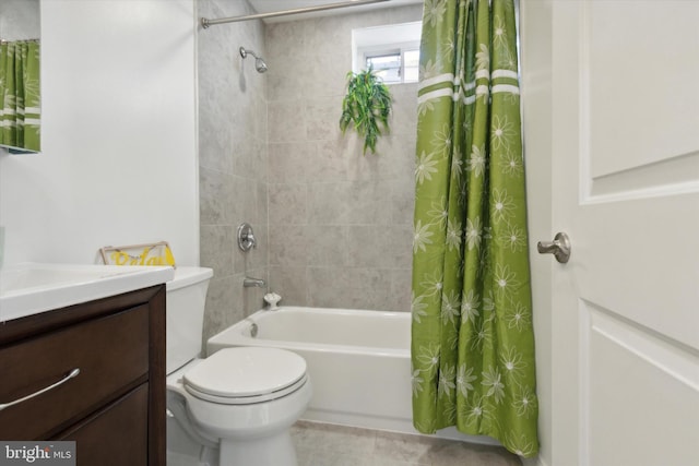 full bathroom featuring vanity, toilet, shower / bath combo with shower curtain, and tile patterned flooring