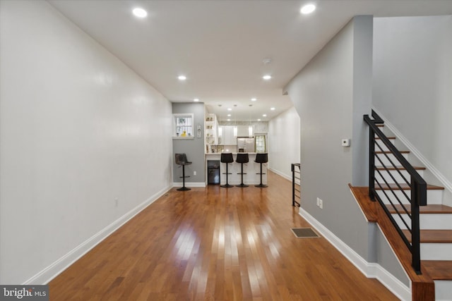 hall featuring wood-type flooring