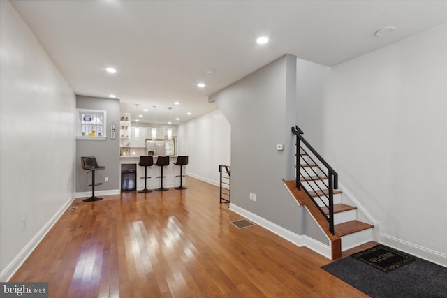 interior space with hardwood / wood-style floors