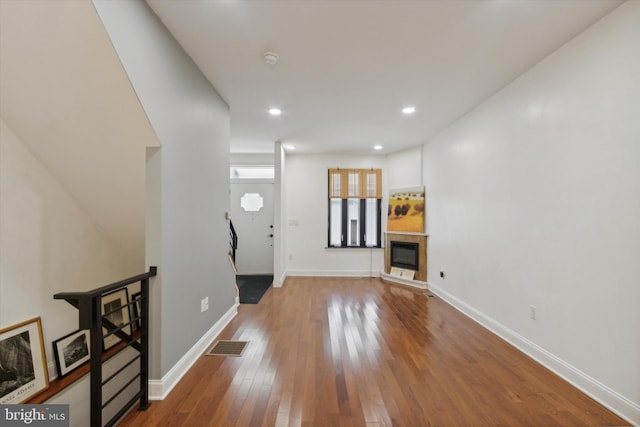 unfurnished living room with hardwood / wood-style floors