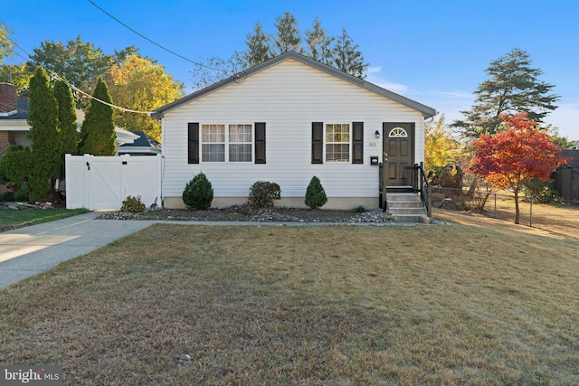 view of front of property with a front lawn