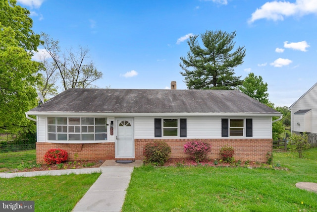 ranch-style home with a front yard