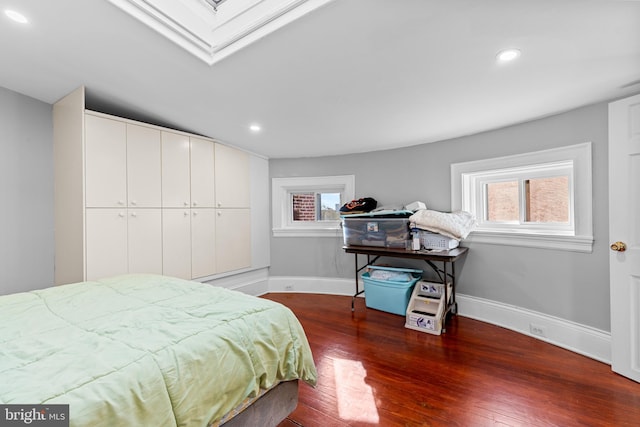 bedroom featuring a closet and dark hardwood / wood-style flooring