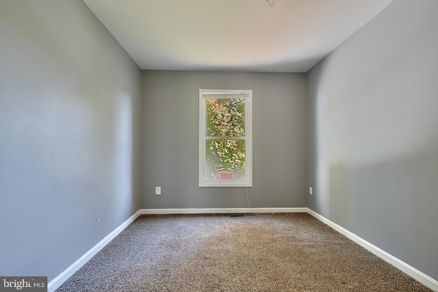 unfurnished room with carpet flooring