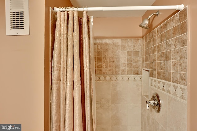 bathroom with a shower with shower curtain