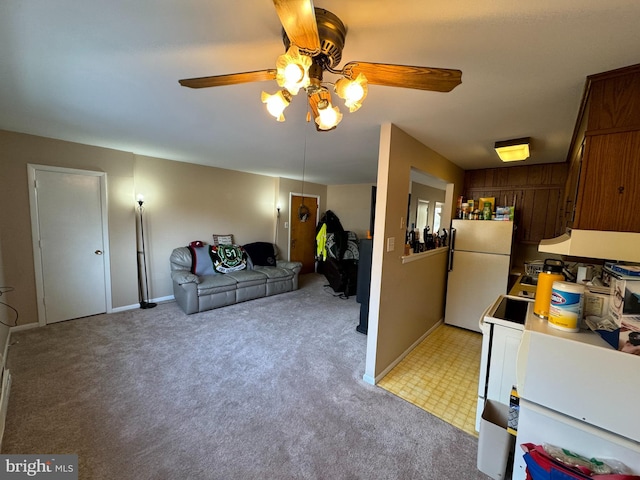 kitchen featuring ventilation hood, light colored carpet, white appliances, and ceiling fan