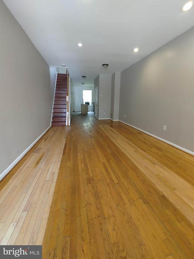 unfurnished living room with light wood-type flooring