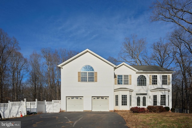 view of front of property featuring french doors and a garage