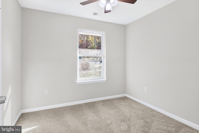 spare room with carpet flooring and ceiling fan