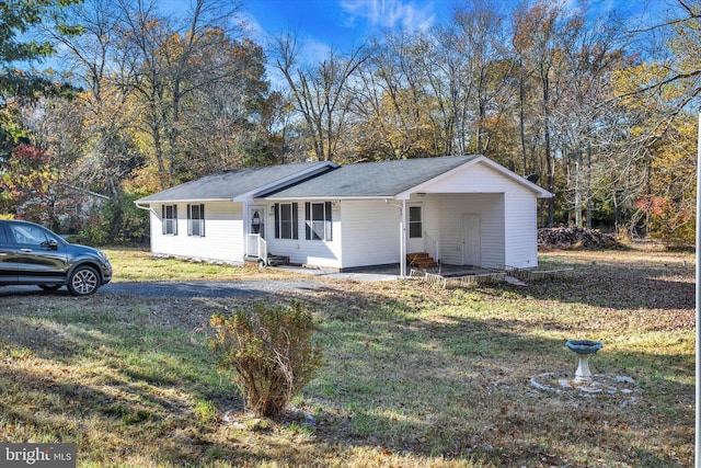 ranch-style home featuring a front yard