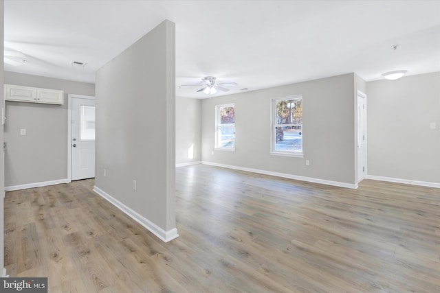 interior space with ceiling fan and light hardwood / wood-style flooring