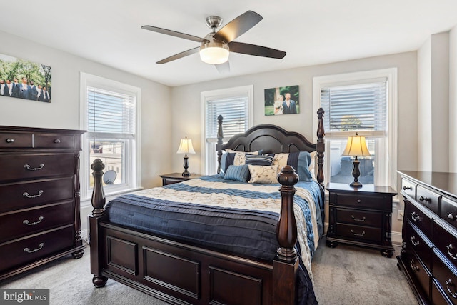 bedroom featuring light carpet and ceiling fan