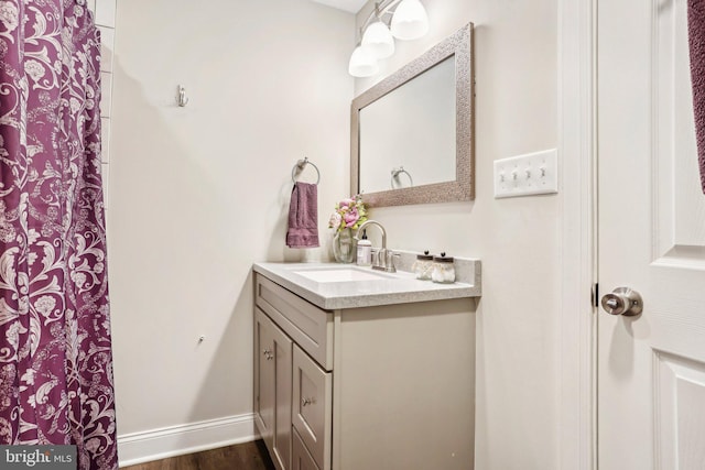 bathroom with vanity and hardwood / wood-style flooring